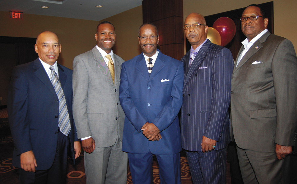  GREAT WORK—Awardees Gilbert Cannon, Richard Taylor, Esq., Edward Greene and Richard Portis standing in for Kenneth Elliot stand with Dr. Mitchel Nickols, center, after his keynote address. (Photos by Diane I. Daniels) 